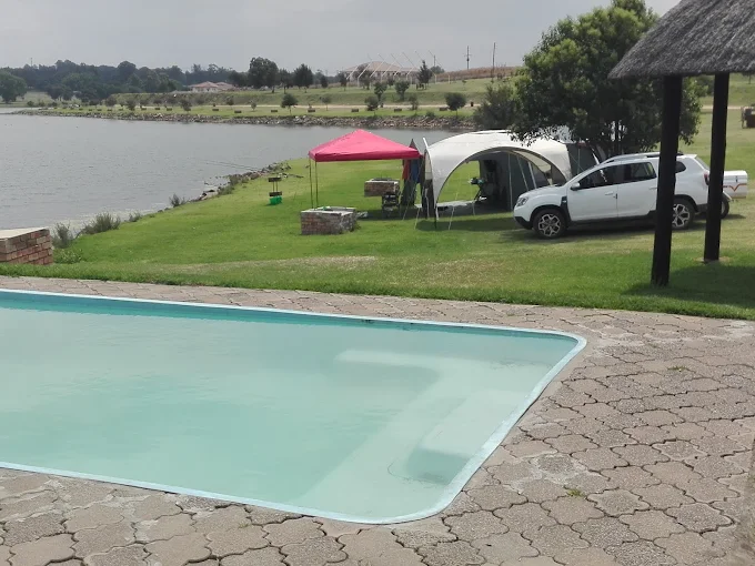Pool and camping area near the water at Maanlig Oord