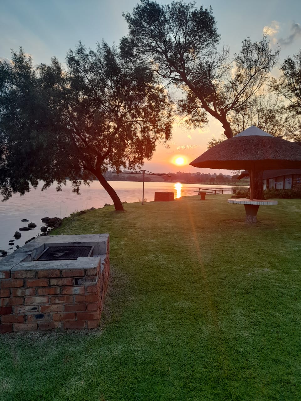 Sunset over the water at Maanlig Oord